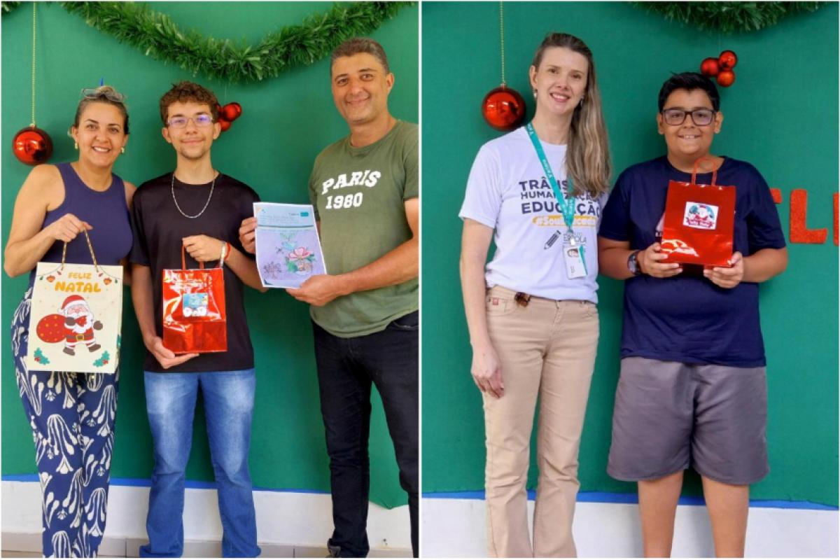 Gabriel Ribeiro Alves, ao lado do pai com a professora Eliane Aparecida, e Arthur Garcia, recebendo o celular de uma funcionária da ViaPaulista