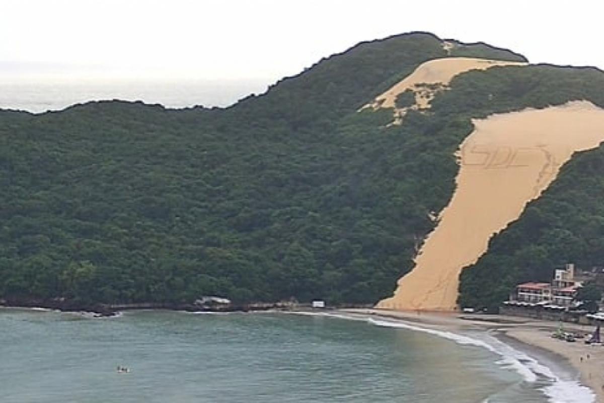 Sigla SDC escrita no Morro do Careca